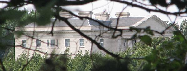 The upper floor of Tusmore Park, glimpsed through the trees Tusmore Park