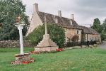 The town sign and cottages