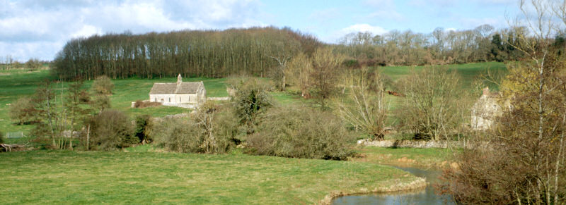 View North across the Windrush to St Oswold's Church, Widiford
